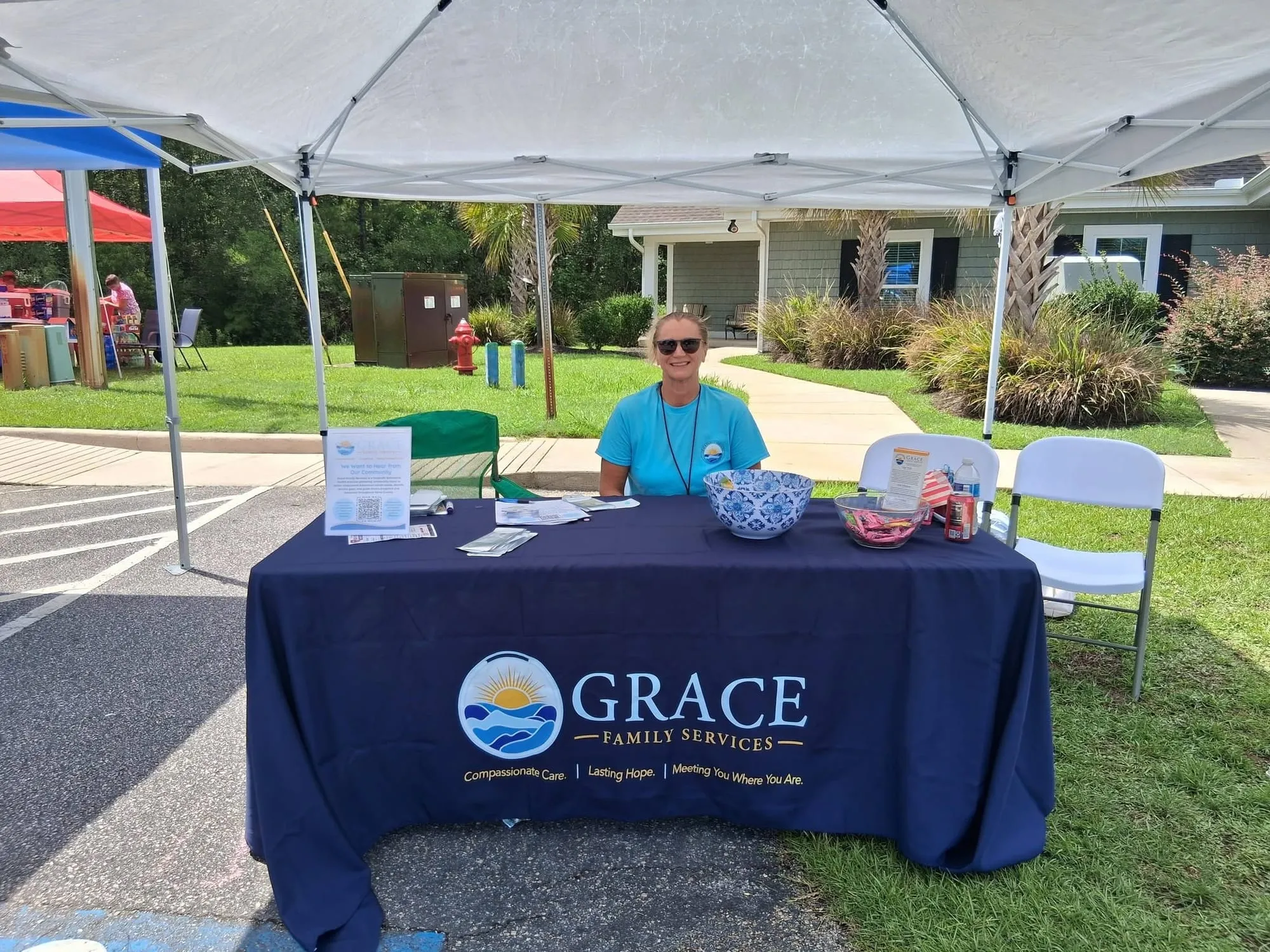 Grace Family Services outreach table at the Sea Haven for Youth community event in Little River
